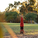 arati lane yoga headstand grass field
